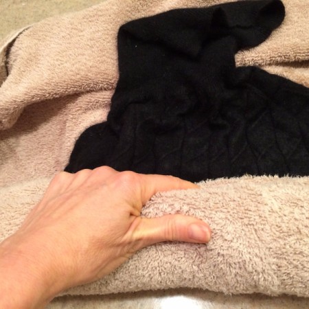 How to Wash a Cashmere Sweater - roll the sweater up in the towel
