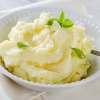 A dish of mashed potatoes with ranch dressing.