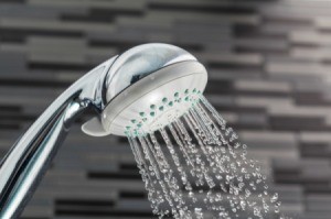A showerhead with water running.