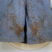 A pair of jeans with dirt stains.