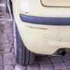 Black scuff marks on a car's bumper.