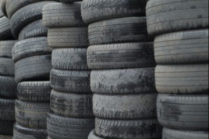 Tall stacks of used car tires.