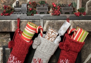 Stockings hung on a fireplace mantle.