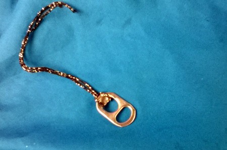 Tab with yarn looped on