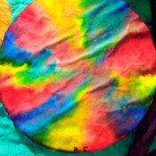 Coffee filter with tie dye color pattern.