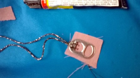 check fitting face placement on fabric against tab opening