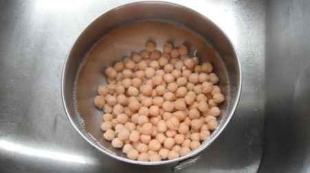 chickpeas with water rinsing in bowl