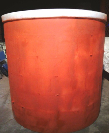 cylinder covered in red paint