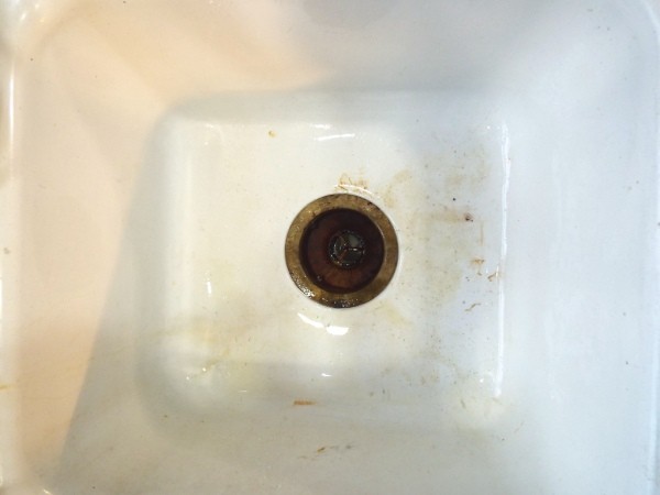 closeup of older sink with rust stains