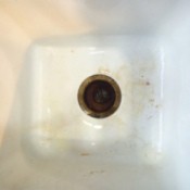 closeup of older sink with rust stains