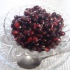 Pomegranate Deseeding- A bowl of pomegranate seeds, ready for eating.