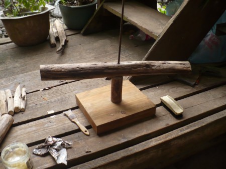 Driftwood Christmas Tree - adding the tree branches to the iron bar to begin building the tree