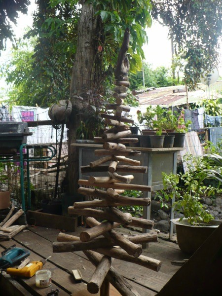 Driftwood Christmas Tree - finished tree and tools on a wooden deck