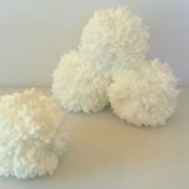 A pile of indoor snowballs made from yarn.