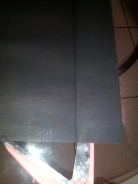 cutting a strip of black paper