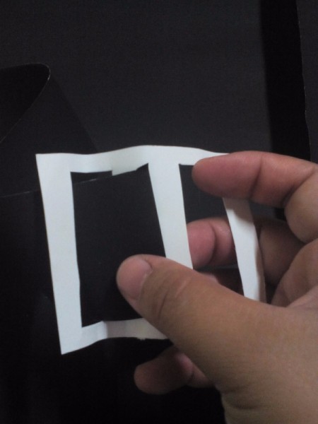 threading the black paper belt through the buckle