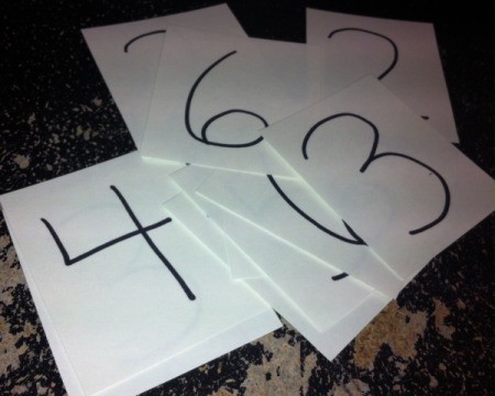 Christmas Sticker Memory Game - cards with numbers written on them