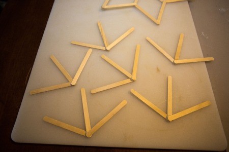A collection of glued double "v" popsicle sticks.