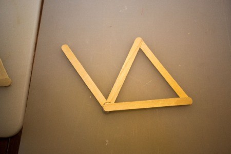 Popsicle sticks glued as a double "v".