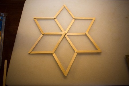 Popsicle sticks in the shape of a six pointed star.