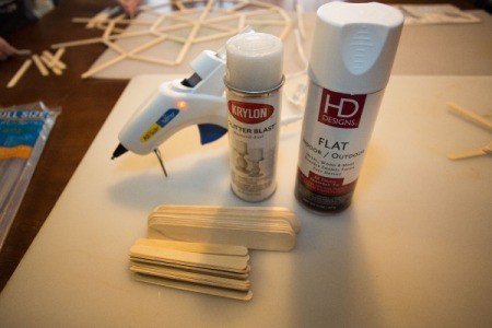 Supplies for popsicle stick snowflakes.