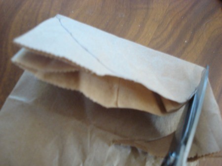 Draw a semicircle on the bag and cut out.