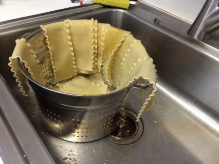 A pot of lasagne noodles, cooked and drained.
