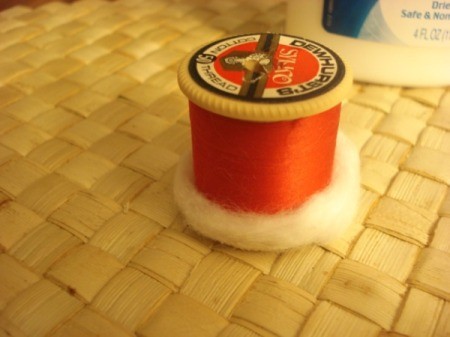 Spool Santa Ornament - glue a thin strip of cotton to one edge of the spool