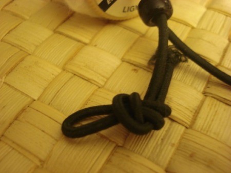 Spool Santa Ornament - Tie both ends of the string with a loose knot for Santa's shoes.