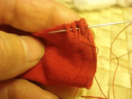 Spool Santa Ornament - fold the red triangular fabric in half and sew up the open side.