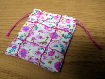 Fabric and Button Tic-Tac-Toe Game - tie ends of the embroidery floss on the front and back of bag to each other