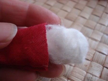 Spool Santa Ornament - gluing on the head using a strip of cotton for head