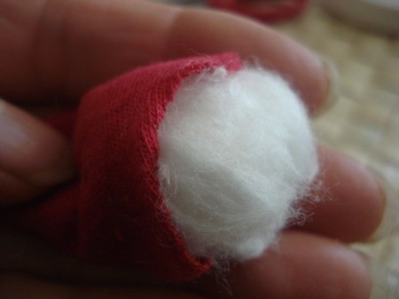 Spool Santa Ornament - closeup of cotton strip head inside the hat