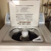 A washing machine with the lid open.