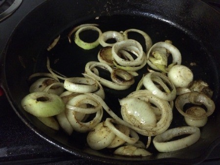 onions frying in skillet