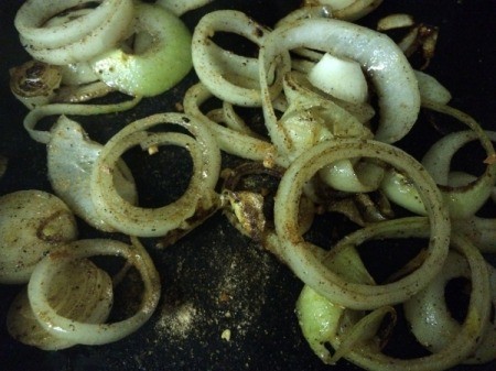 onions frying in skillet