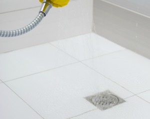 Cleaning a shower floor.