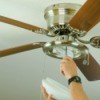 A new ceiling fan being installed.
