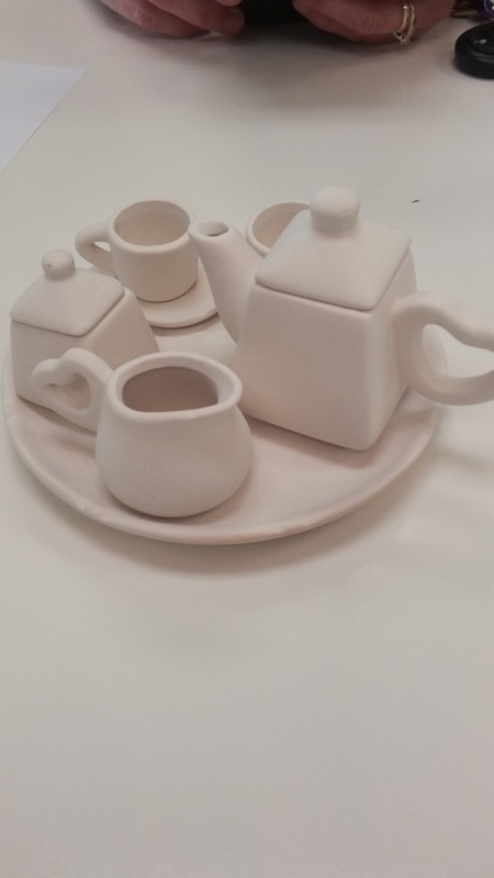 Unpainted pottery tea set, ready for glazing.