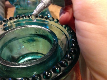 Thriftstore Glass Garden Tower - adding a ribbon of glue to the bottom edge of the insulator