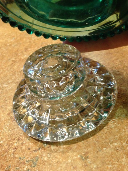 Thriftstore Glass Garden Tower - getting ready to set the insulator on the smaller molded clear candleholder