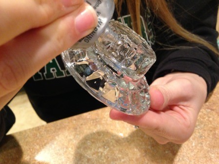 Thriftstore Glass Garden Tower - adding ribbon of glue to the clear glass candleholder to be attached to insulator