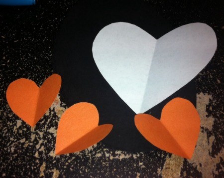 Heart Shaped Paper Penguin - glue all pieces in order onto the oval, adding eyes last