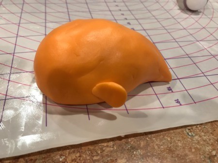 'Sharky' Goldfish Birthday Cake - create the body of the goldfish using orange fondant and add fins