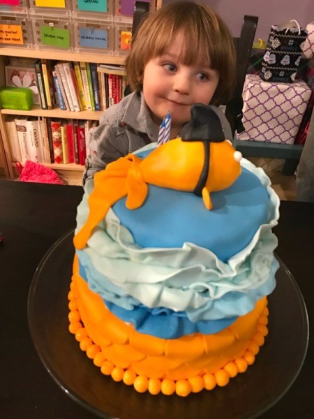 'Sharky' Goldfish Birthday Cake - cake on table in front of birthday boy