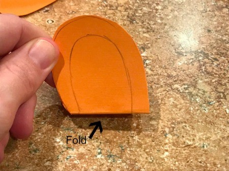 'Sharky' Goldfish Paper Lantern Decoration - draw a mouth on folded piece of paper and cut out