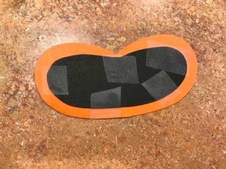 'Sharky' Goldfish Paper Lantern Decoration - cut out black shape and tape to back of the orange lips- view with taping done