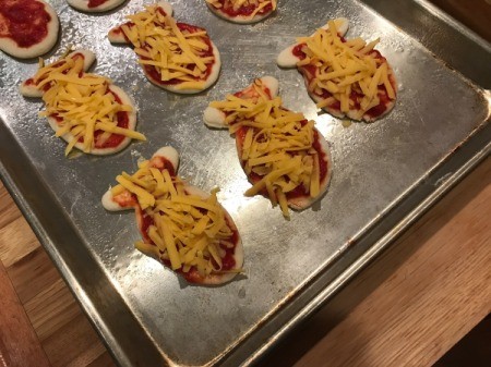 Goldfish Shaped Mini Pizzas - cheese added to top
