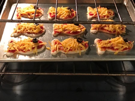 Goldfish Shaped Mini Pizzas - pizzas in the oven