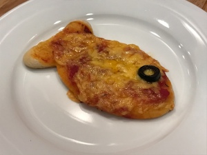Goldfish Shaped Mini Pizzas - single goldfish shaped pizza own a white plate